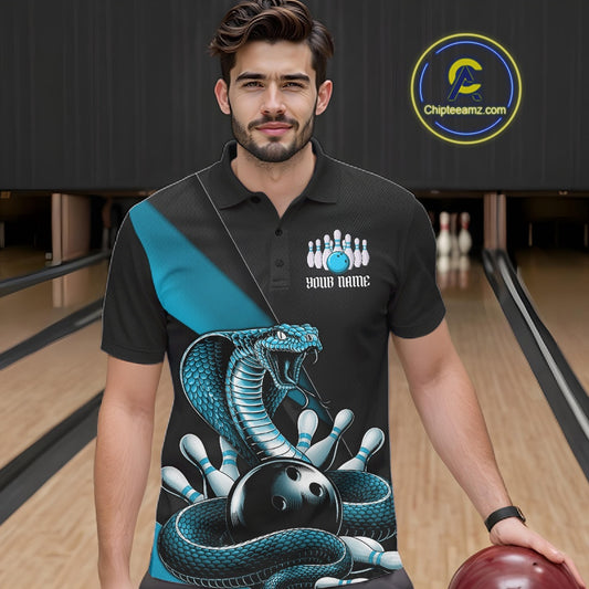 Male model wearing a black bowling polo in a bowling center with blue cobra artwork and bowling-themed accents.