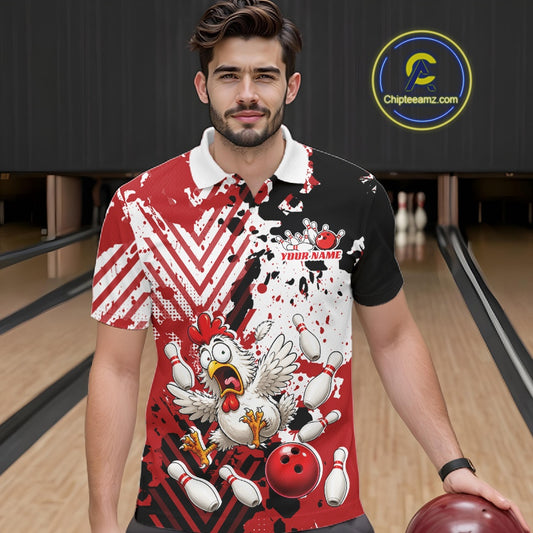 A man in a bowling alley wearing a custom short-sleeve bowling polo shirt with a red, black, and white splatter design, a cartoon chicken graphic, and a white collar.
