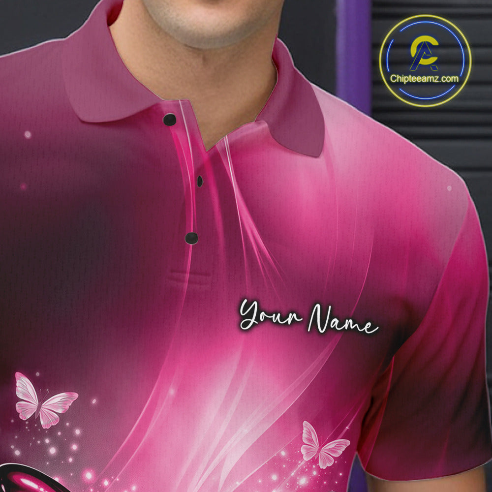 Close-up of the left chest on a pink bowling polo shirt showcasing a butterfly beside a bowling ball and scattered bowling pins.