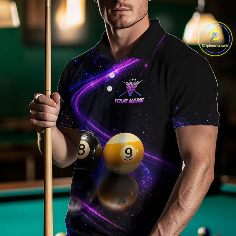 A man wearing a black short-sleeve polo shirt with a purple and blue galaxy print, featuring a crown logo and the text 'YOUR NAME' on the chest. He is holding a pool cue in a dimly lit pool hall environment.