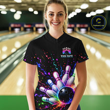 Load image into Gallery viewer, Person wearing a black bowling-themed shirt with colorful design in a bowling alley.