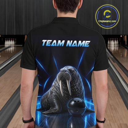 Person wearing a black t-shirt with a walrus graphic and 'TEAM NAME' text in a bowling alley.