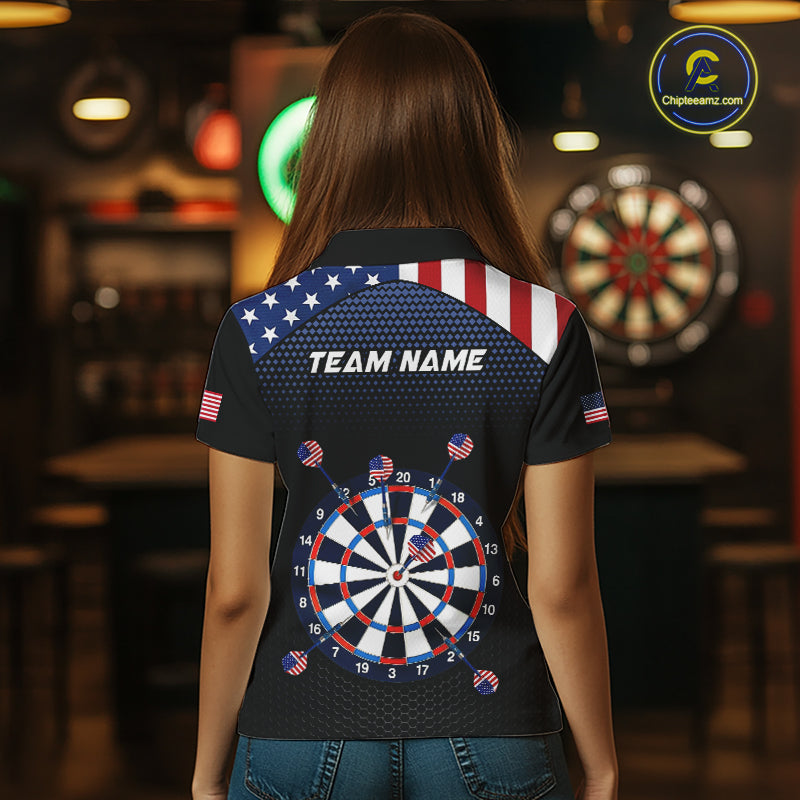 Back view of a woman wearing a custom patriotic dart polo with personalized team name and an American flag dartboard graphic in a professional dart room.