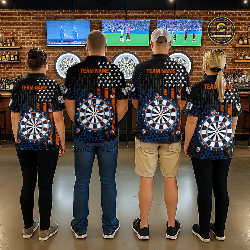 Back view of four people in a sports bar wearing matching custom darts team polo shirts with an American flag design, a dartboard graphic, and 'TEAM NAME' text.