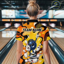 Load image into Gallery viewer, Person wearing a colorful bowling shirt with cartoon characters in a bowling alley.