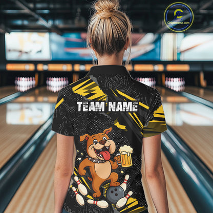 A woman wearing custom black yellow bulldog bowling quarter-zip shirt back view featuring a playful cartoon mascot, bowling ball and beer mug, displaying Your Name, at the bowling alley