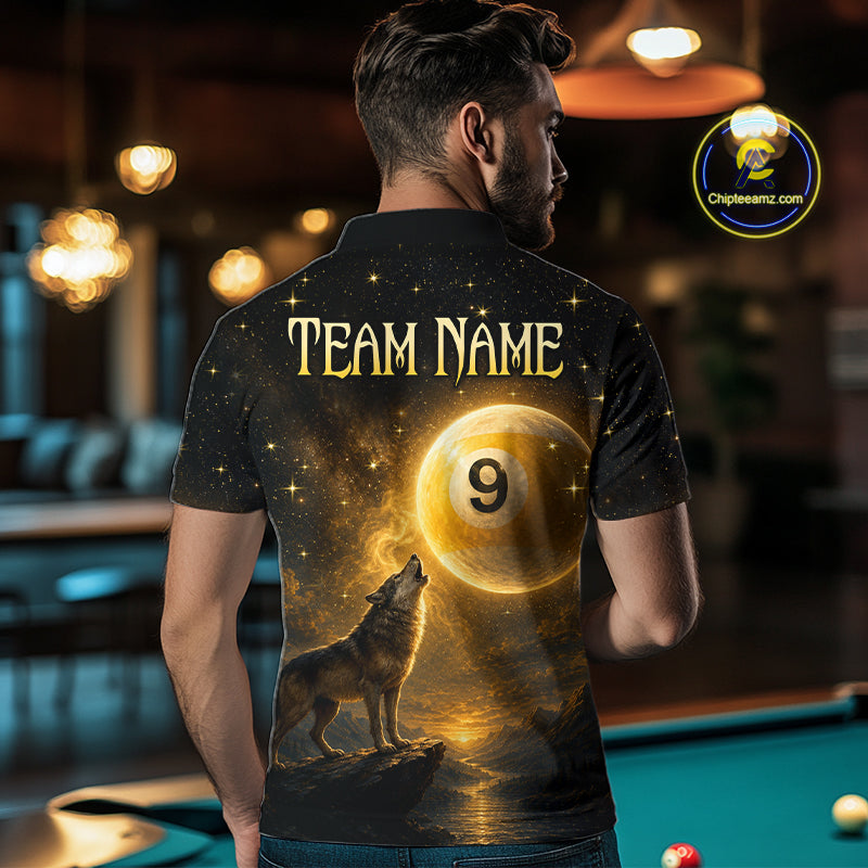 A man viewed from behind wearing a black short-sleeve polo shirt with a large custom graphic print. The print features the text 'TEAM NAME' in gold, a glowing billiard ball with the number 9, and a howling wolf in a golden cosmic scene.