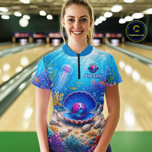 Load image into Gallery viewer, Woman wearing a colorful bowling shirt with a marine design in a bowling alley.