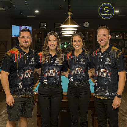 A team of four pool players stand in front of a blue felt pool table in a billiards room. All four are wearing the front view of the custom blue and yellow billiards polo shirt with a funny hip hop bulldog and 8-ball motif, and 'YOUR NAME' text placeholder. 