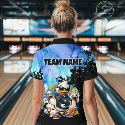 Person wearing a colorful shirt with cartoon characters and 'TEAM NAME' text in a bowling alley.