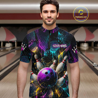 A man wearing a short-sleeve bowling-themed graphic shirt with a purple bowling ball, pins, and colorful paint splatter design. The shirt has a mock collar and the text 'YOUR NAME' on the chest.