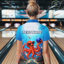 Load image into Gallery viewer, Person wearing a blue shirt with an octopus design and 'TEAM NAME' text in a bowling alley.