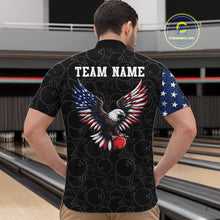 Load image into Gallery viewer, Man wearing a black t-shirt with an eagle design and 'TEAM NAME' text at a bowling alley.