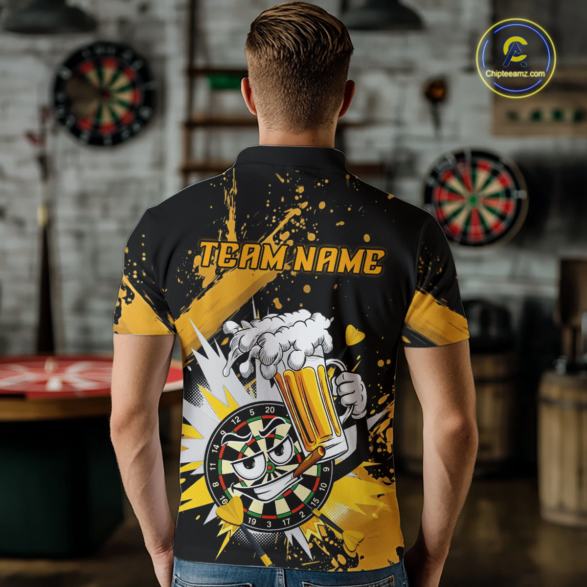 A man viewed from behind wearing a black and yellow short-sleeve polo shirt with a custom dartboard-themed graphic on the back. The shirt features the text 'TEAM.