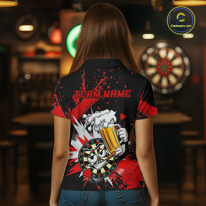 A woman viewed from behind wearing a black short-sleeve polo shirt with a red and white graphic print on the back. The design features the text 'TEAM NAME' above a cartoon hand holding a foaming beer mug with a dartboard motif.