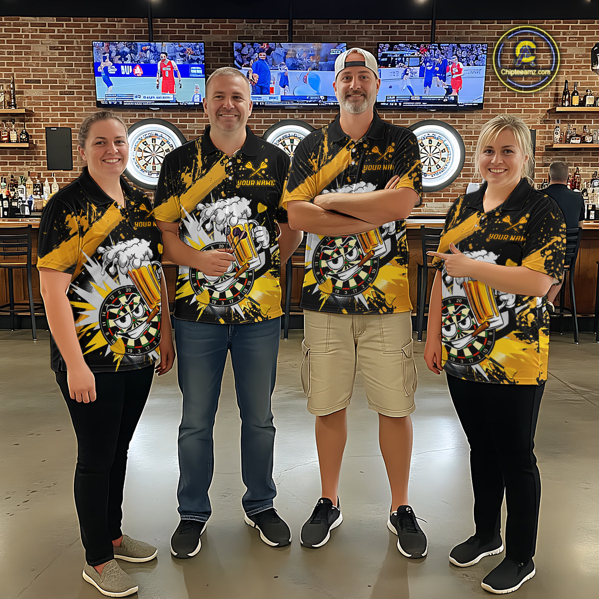 Four people standing together in a bar or lounge setting, wearing matching black and yellow athletic-style shirts with a large beer-themed graphic print. The shirts feature black, yellow, white.