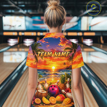 Load image into Gallery viewer, Person wearing a colorful shirt with a beach-themed design in a bowling alley.