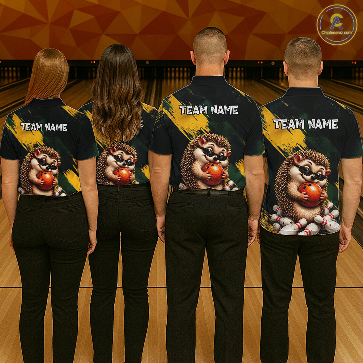 Four people standing in a bowling alley, viewed from behind, wearing matching dark navy bowling shirts with a large hedgehog graphic holding red bowling balls and white 'TEAM NAME' text on the back.