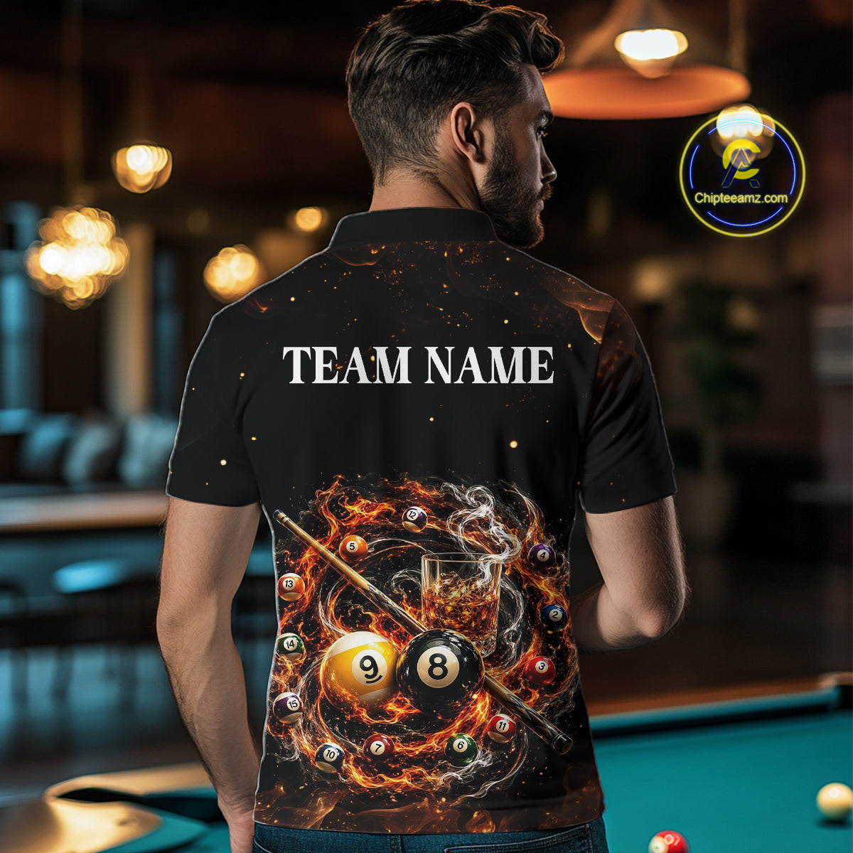 Person wearing a black shirt with a pool-themed design and 'TEAM NAME' text, standing in a bar.
