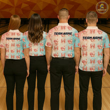 Load image into Gallery viewer, Four people wearing matching shirts with a crab pattern and 'Team Name' text on a bowling alley background.