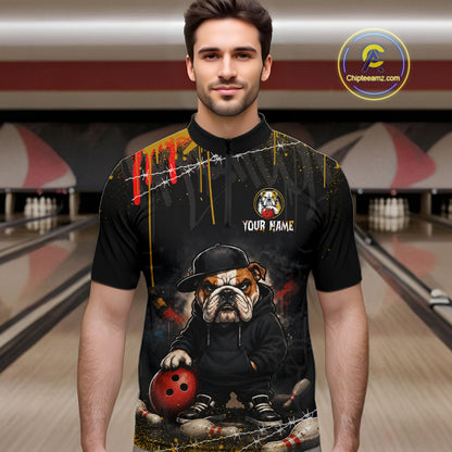 Man wearing custom black bulldog bowling quarter-zip shirt front view featuring a fierce cartoon mascot, bowling ball and paint drip effect, displaying Your Name, at the bowling alley