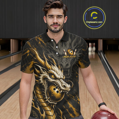 A man wearing a black and gold bowling-themed polo shirt with a large dragon graphic and a bowling pin logo, standing in a bowling alley. 
