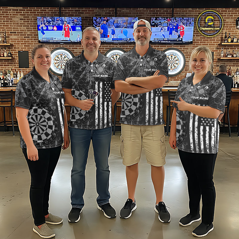 Four people wearing darts polo shirt featuring dartboard graphics blended with a american flag pattern on a black gray background.