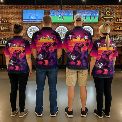 Four people wearing darts polo shirt featuring a dinosaur holding a dartboard with sunset and palm tree artwork on a colorful background.