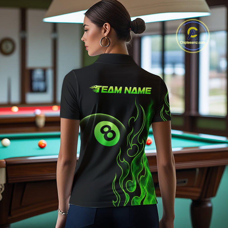 Women wearing billiards polo shirt featuring an eight ball design surrounded by flowing green flame graphics on a black background.