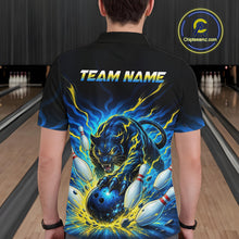 Load image into Gallery viewer, Person wearing a black bowling shirt with a colorful design and 'TEAM NAME' text in a bowling alley.