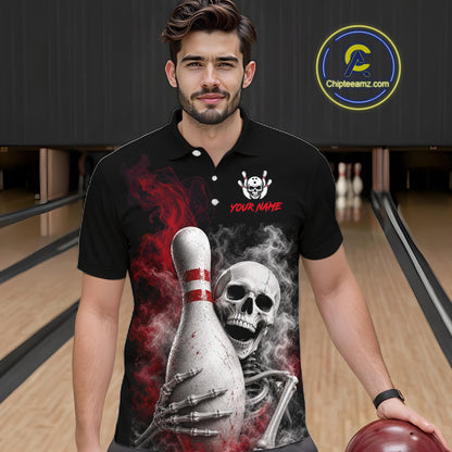 A man wearing a black short-sleeve polo shirt with a bowling-themed graphic print featuring a skeleton, bowling pins, smoke, and red accents. The shirt has a placeholder logo and the text 'YOUR NAME'.