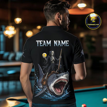 Man wearing a black t-shirt with a graphic design of a skeleton on a shark, with 'TEAM NAME' text, in an indoor setting.