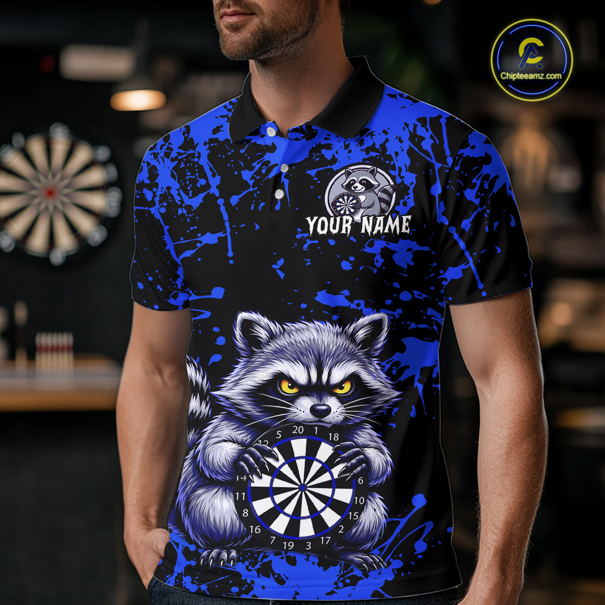 Person wearing a blue and black polo shirt with a raccoon holding a dartboard design.