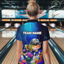 Load image into Gallery viewer, Woman wearing an underwater-themed bowling polo featuring a fish mascot wearing sunglasses and a cap, colorful coral reefs, bowling pins, bowling balls, and custom team text.