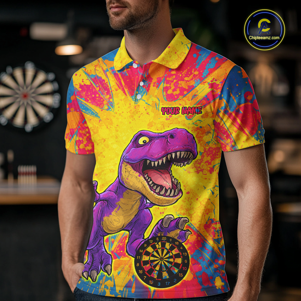 Man wearing darts polo shirt featuring a purple dinosaur holding a dartboard within a bright colorful paint splatter background.