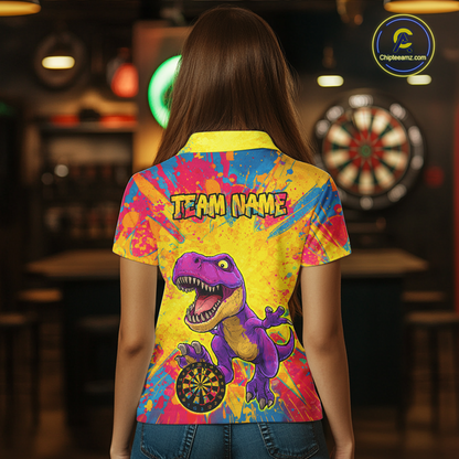 Women wearing darts polo shirt featuring a purple dinosaur holding a dartboard within a bright colorful paint splatter background.