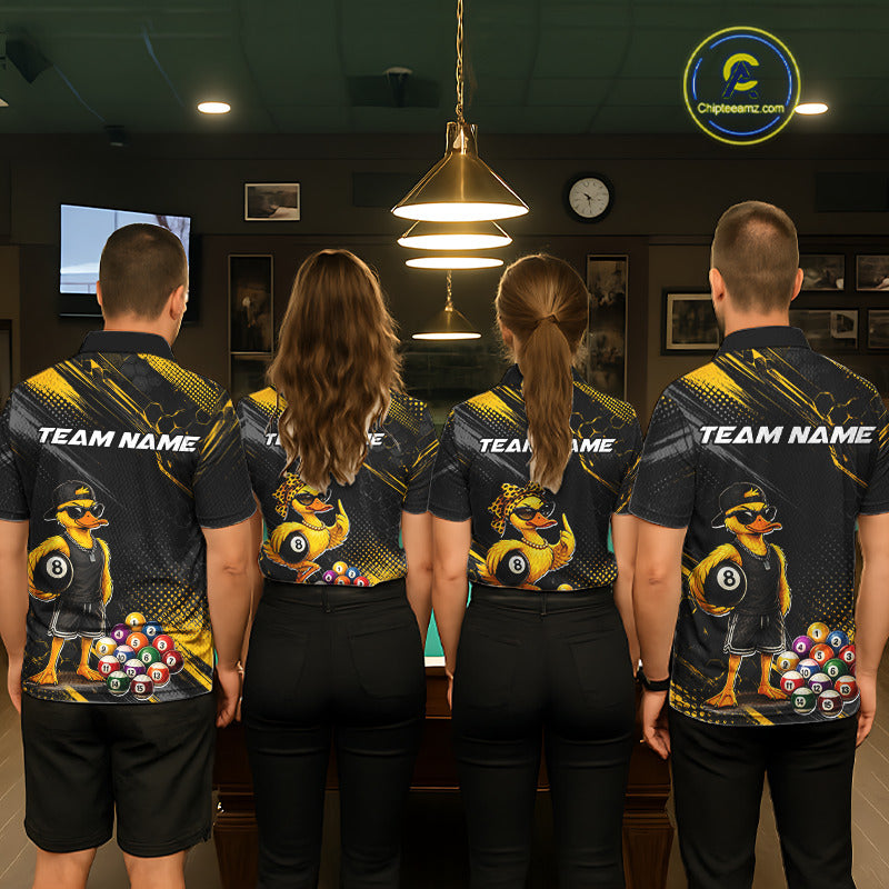 Four people wearing billiards polo shirt featuring a duck holding an eight ball with colorful pool balls arranged on a black yellow background.
