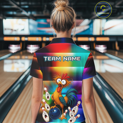 Woman wearing a colorful bowling polo featuring a shocked rooster chicken, blue bowling ball, surprised pins, and custom team name text.