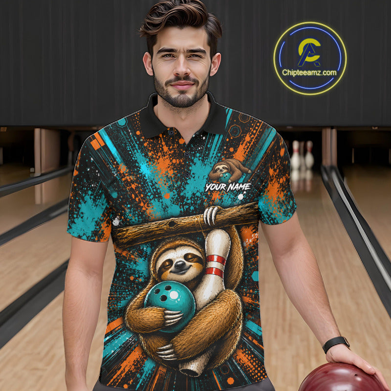A man wearing a short-sleeve polo shirt with a colorful sloth graphic holding a bowling ball, standing in a bowling alley. The shirt features a black collar and a busy multicolor print with teal, orange, brown, and black splatter patterns, along with a 'YOUR NAME' customization placeholder.