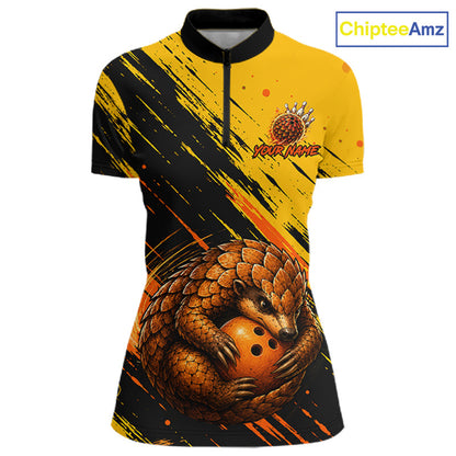 A short-sleeve quarter-zip athletic shirt with a yellow and black brushstroke design, featuring a large 3D-effect pangolin graphic clutching a bowling ball on the lower front. The shirt has a black collar and cuffs, and the text 'YOUR NAME' is printed on the chest alongside a small logo.