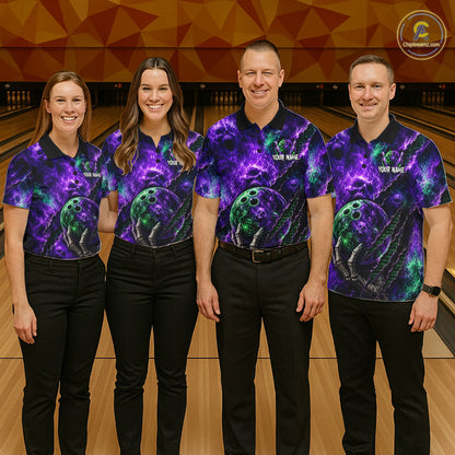 Four people standing on a bowling lane wearing matching short-sleeve bowling shirts with a purple, blue, and green cosmic/nebula print and bowling ball graphics. The shirts have dark navy collars and sleeves, and the men's shirts also have dark pants.