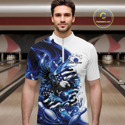 Front view male model in a bowling lane wearing a white and blue quarter zip shirt with eagle artwork, bowling elements, and flowing flag inspired graphics.