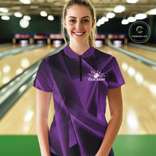 Load image into Gallery viewer, Person wearing a purple bowling shirt with a logo and text in a bowling alley.