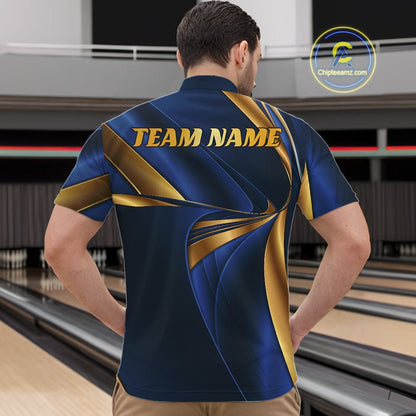 A man viewed from behind wearing a custom bowling shirt with a blue and gold abstract pattern and 'TEAM NAME' printed on the back, standing in a bowling alley.