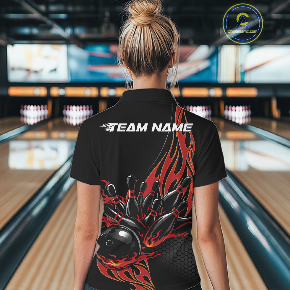 Female model seen from the back in a bowling lane wearing a black polo shirt featuring a red flaming black bowling ball striking pins in a dynamic sports illustration.