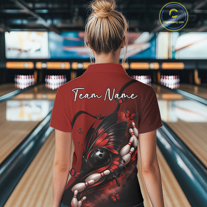 Back view of a female model in a bowling venue wearing a red and black polo shirt featuring a butterfly wrapped around a bowling ball.