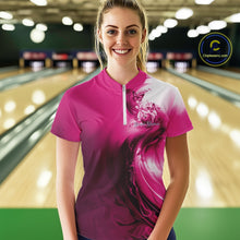 Load image into Gallery viewer, Female model wearing a pink bowling quarter zip with butterfly graphics and bowling artwork, front view at the bowling lane