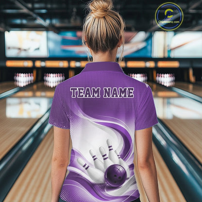 Back view of a female model in a white and purple bowling quarter-zip featuring elegant wave artwork and a dynamic bowling scene