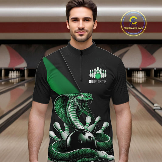 Male model wearing a black quarter-zip at the bowling lane with green cobra artwork and bowling-themed accents.