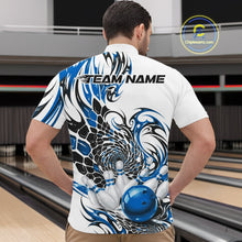 Load image into Gallery viewer, Male model at the bowling lane wearing a white bowling quarter-zip shirt with blue and black tribal graphics and a glossy red bowling strike design